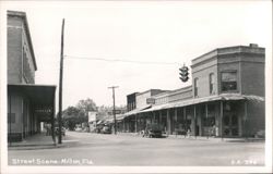 Downtown Street Scene with Shops, Cars, and Traffic Light Postcard