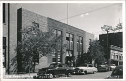 U.S. Post Office building with cars parked Postcard