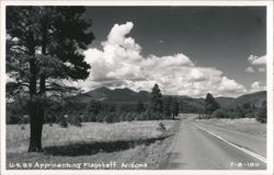 U.S. 89 Approaching Flagstaff, Arizona, with Mountains and Clouds Postcard