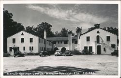 Wakulla Springs Lodge with automobiles in front Postcard