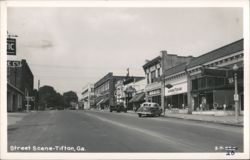 Main Street with Goodyear, Firestone, Wright's Drugs, Sears stores Postcard