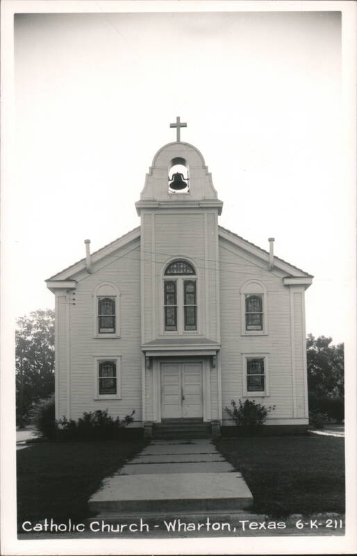 White Wooden Catholic Church with Bell Tower and Cross Wharton Texas