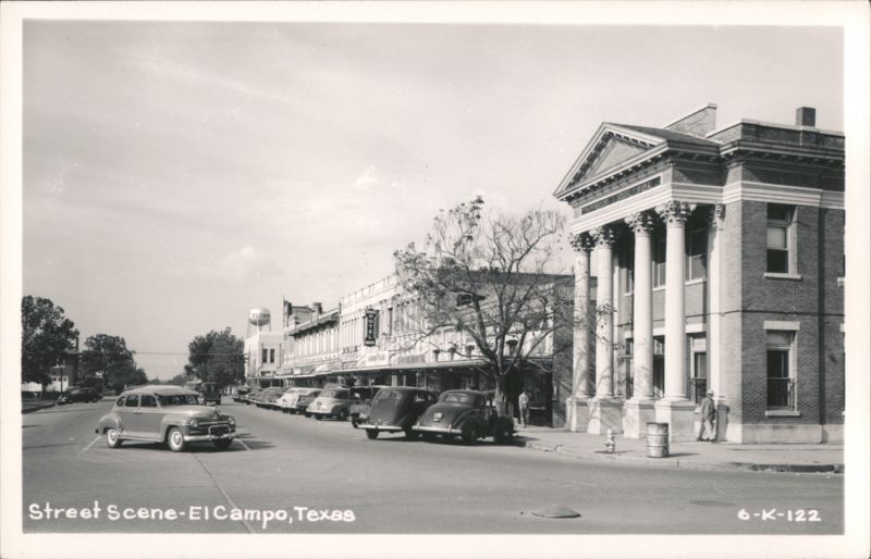 Downtown Street Scene with Bank Building and Parked Cars El Campo Texas