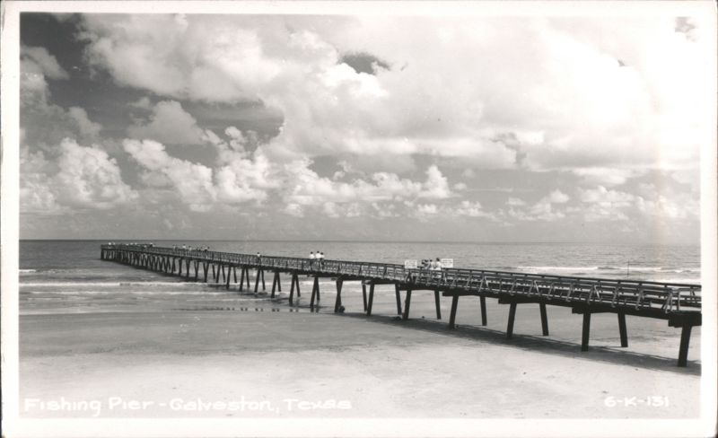 Fishing Pier extending into the ocean from a sandy beach Galveston Texas