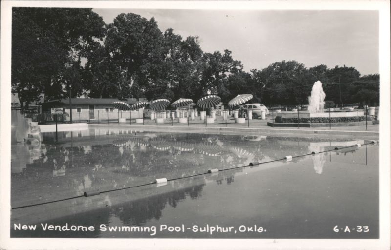 New Vendome Swimming Pool with fountain and umbrellas Sulphur Oklahoma
