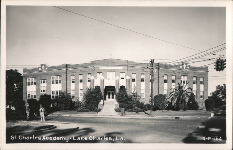St. Charles Academy building with people and street view Lake Charles Louisiana