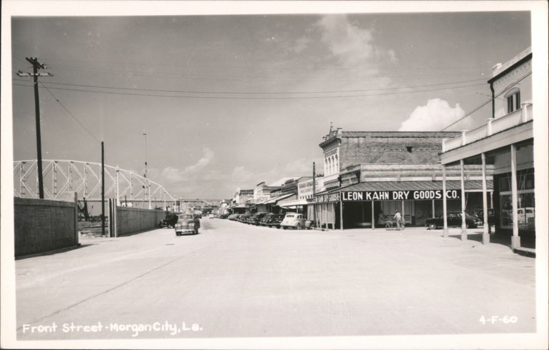 Front Street view with Leon Kahn Dry Goods Co. and bridge Morgan City Louisiana