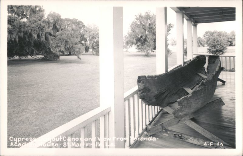 Cypress dugout canoe and view from veranda, Acadian House Saint Martinville Louisiana