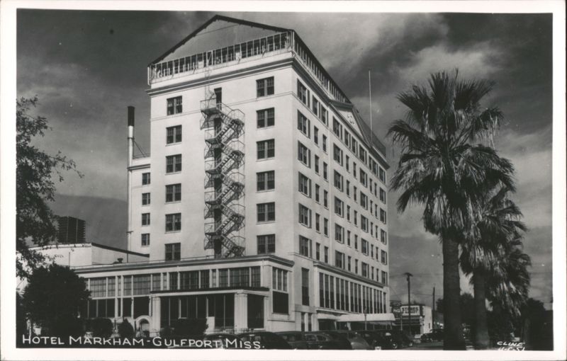 Hotel Markham with exterior fire escape and palm trees Gulfport Mississippi