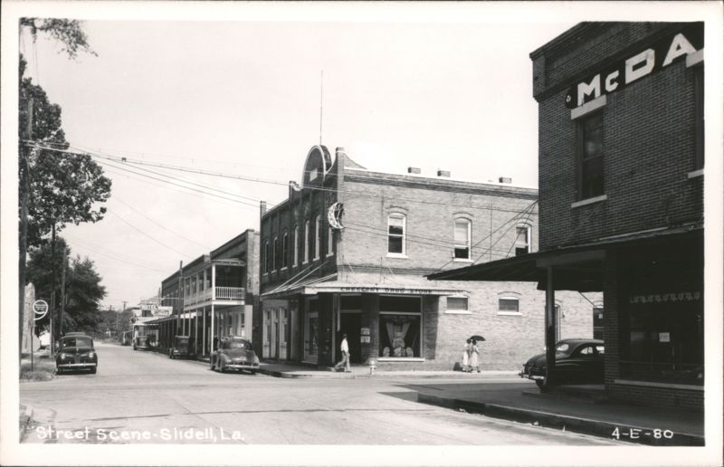 Street Scene with Clemens Drug Store and Vintage Cars Slidell Louisiana