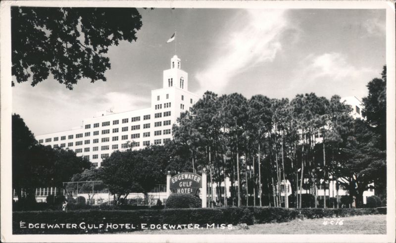 Edgewater Gulf Hotel with Tower, Flag, and Palm Trees Mississippi