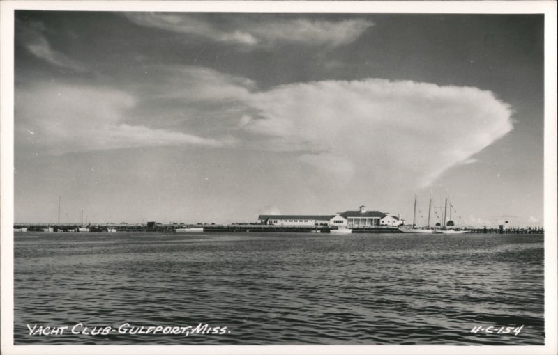 Yacht Club building and docks with large cloud formation Gulfport Mississippi