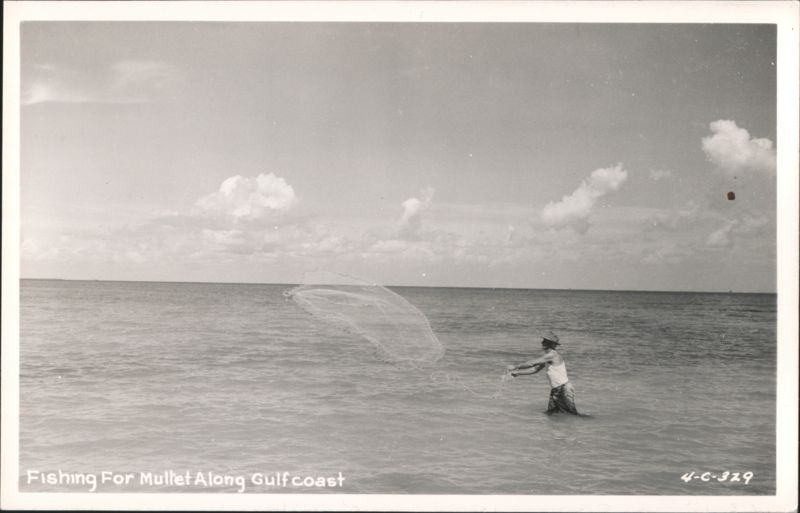 Man casting net for mullet fishing along Gulfcoast Mississippi