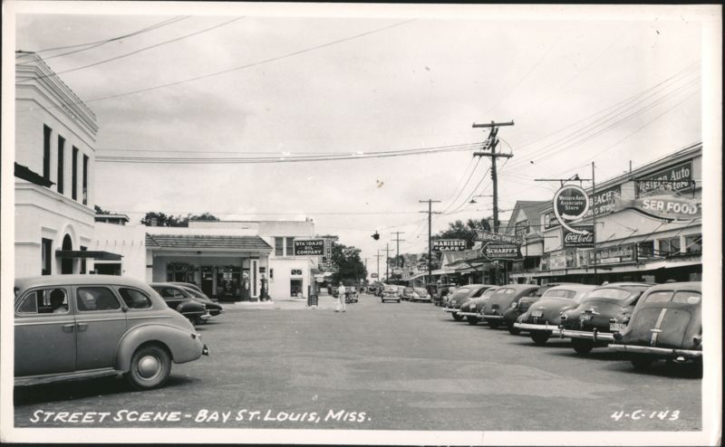 Street Scene with Businesses and Parked Cars Bay Saint Louis Mississippi