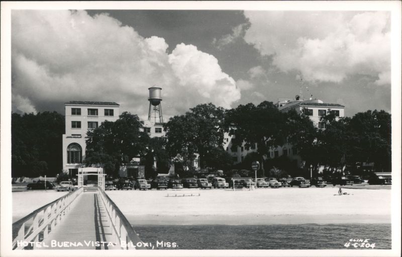 Hotel Buena Vista, beachfront view with pier and parked cars Biloxi Mississippi