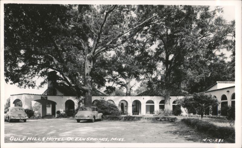 Gulf Hills Hotel with Cars and Large Trees, Ocean Springs Mississippi
