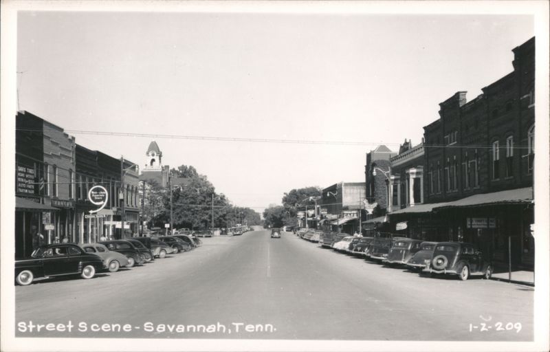 Main Street with Parked Cars and Businesses Savannah Tennessee