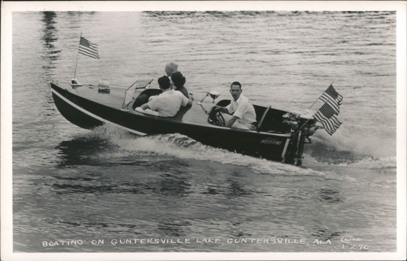 Boating on Guntersville Lake with American flags Alabama