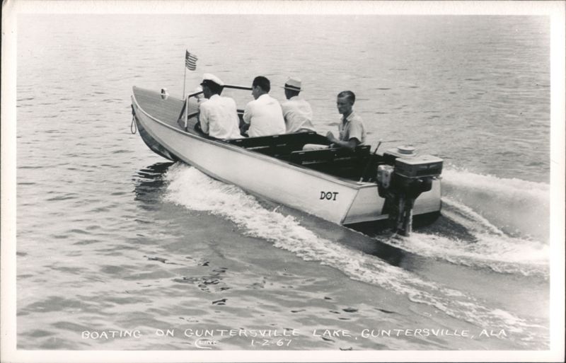 Four men boating on Guntersville Lake, boat named DOT Alabama