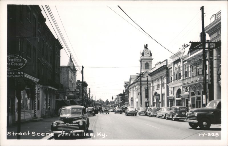 Street Scene with Cars, Businesses, and Clock Tower Versailles Kentucky