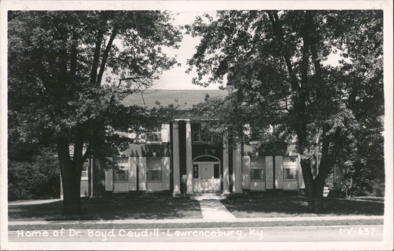 Home of Dr. Boyd Ceudill with large trees and columned portico Lawrenceburg Kentucky