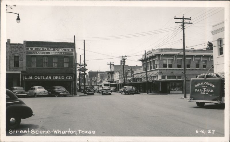 L.B. Outlar Drug Co. and Royal Crown Cola Truck on Main Street Wharton Texas
