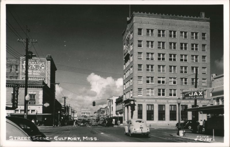 Downtown Gulfport Street Scene with Jax Beer Sign and Tall Building Mississippi