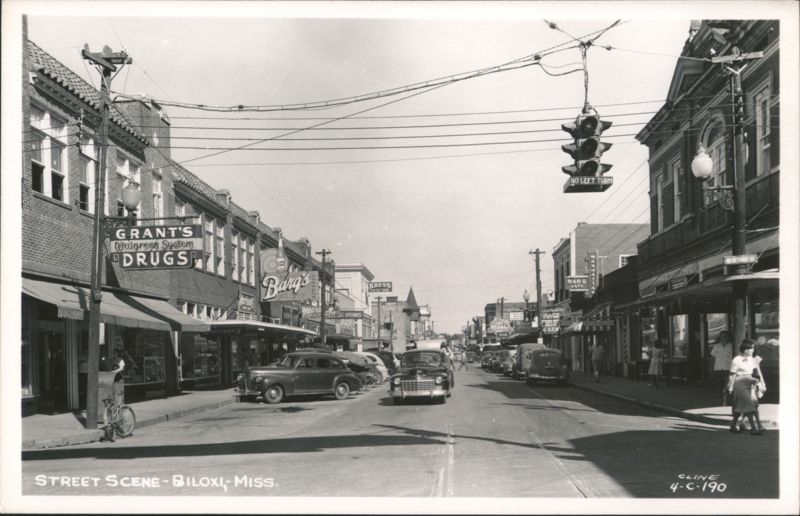 Street scene with Grant's Drugs, Burg's, Kress, cars, and traffic light Biloxi Mississippi