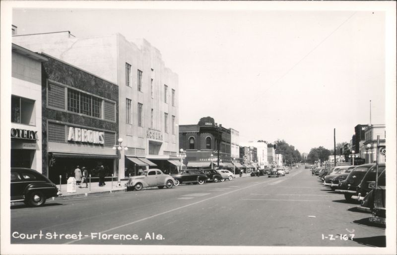 Court Street, Florence, AL, with businesses, cars, and pedestrians Alabama