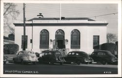 Post Office building with cars parked in front Postcard