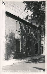 Brewton Inn, brick building with arched doorway Postcard