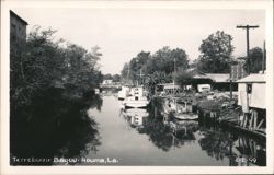 Terrebonne Bayou with Boats and Bridge Postcard