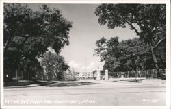 Veteran's Hospital Entrance with Gate and Trees Postcard