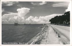 Seawall with Pier and Dramatic Clouds Postcard