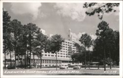 Edgewater Gulf Hotel with Pine Trees and Cars Postcard