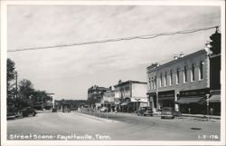 Street Scene with Businesses and Vintage Cars Postcard