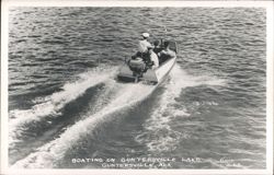 Speed boat with four people on Guntersville Lake Postcard