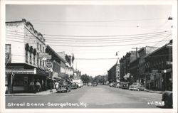Downtown Georgetown Street Scene with Vintage Cars and Businesses Postcard