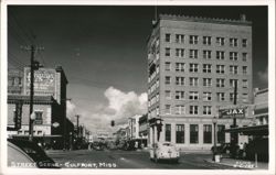 Downtown Gulfport Street Scene with Jax Beer Sign and Tall Building Postcard