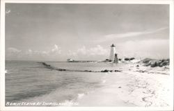 Beach Scene at Ship Island with Lighthouse and Pier Postcard
