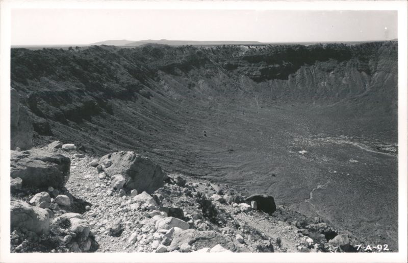 Large desert crater viewed from its rocky rim Winslow Arizona