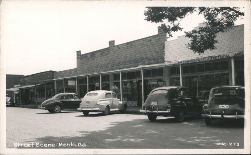 Street Scene with Vintage Cars and Businesses Menlo Georgia