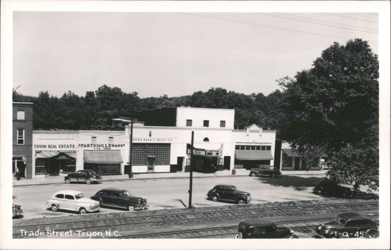 Trade Street with Businesses, Cars, and Railroad Tracks Tryon North Carolina