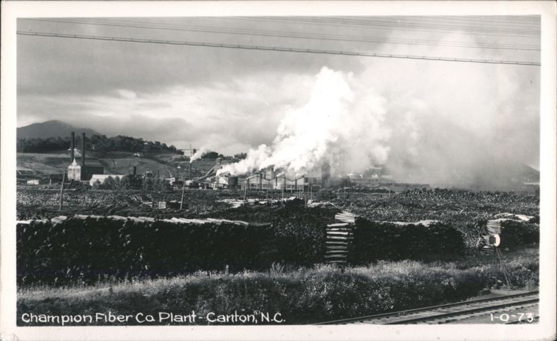 Champion Fiber Co Plant with large log piles and heavy smoke Canton North Carolina