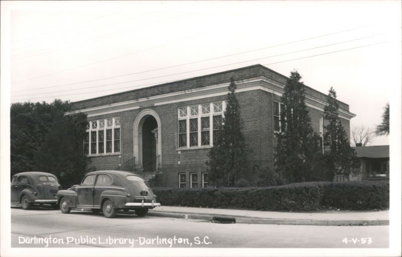 Darlington Public Library with two cars parked on the street South Carolina