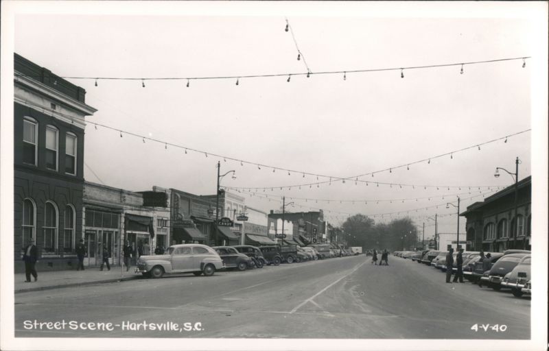 Downtown Street Scene with Parked Cars and String Lights Hartsville South Carolina