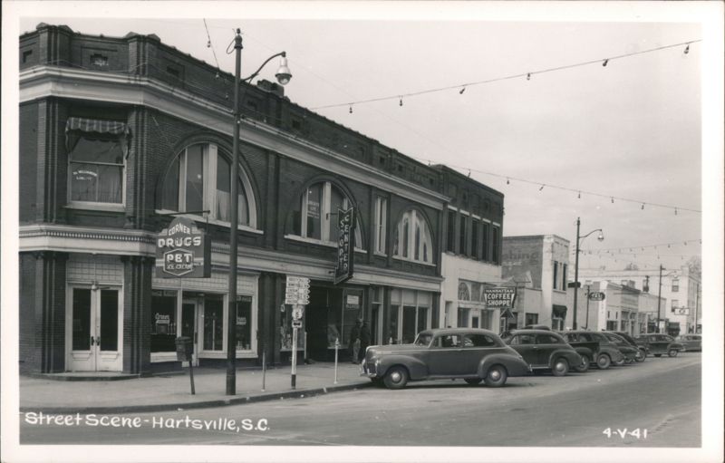 Street Scene with Corner Drugs, Coffee Shoppe, and Vintage Cars Hartsville South Carolina
