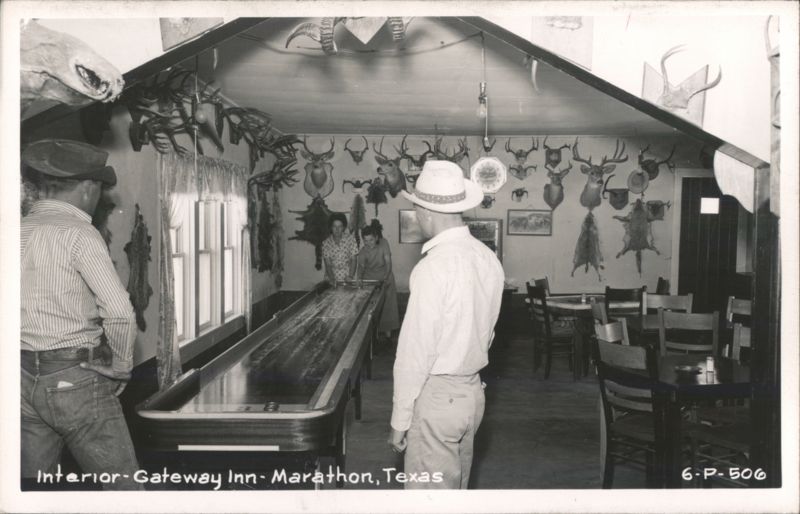 Interior of Gateway Inn with shuffleboard and taxidermy mounts Marathon Texas