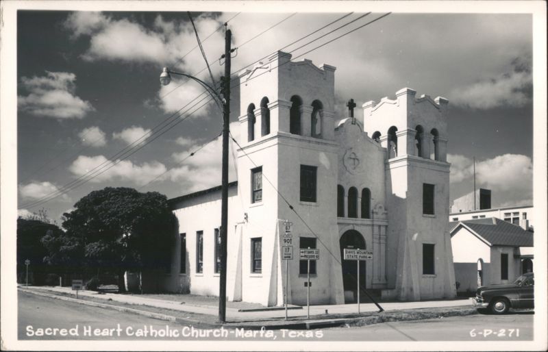 Sacred Heart Catholic Church with Road Signs Marfa Texas