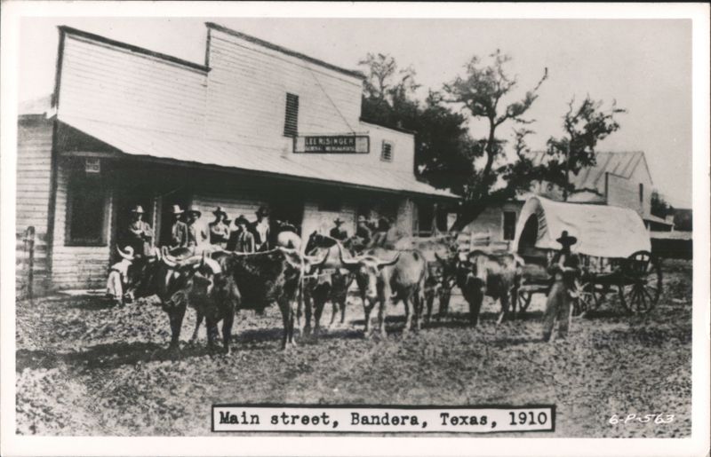 Main Street with Cowboys, Cattle, Covered Wagon, Lee Risinger Store, 1910 Bandera Texas